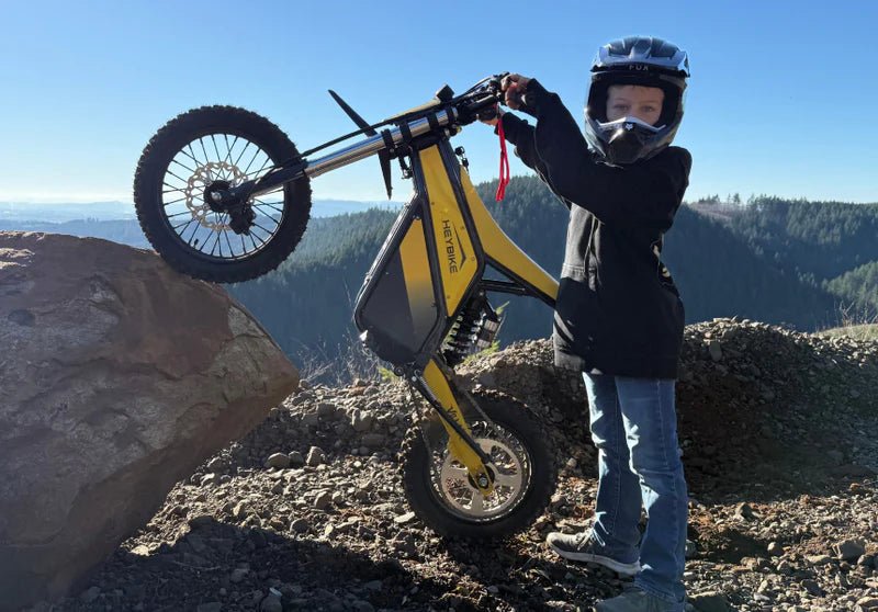 Heybike Villain electric dirt bike riding on a dirt trail demonstrating off-road performance